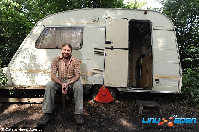 Bizarre: Phil Inkly, pictured, has been forced to live alone in a caravan in remote woodland - because he¿s allergic to technology